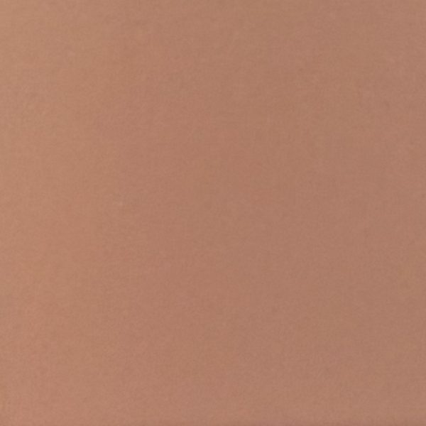 Solid warm beige or taupe colored surface with uniform matte finish