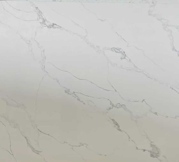 White marble surface with gray and brown veining in organic flowing patterns